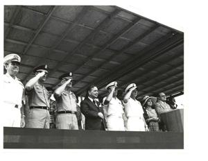 Carl Albert and Henry Bellmon riding in a jeep on Armed Forces Day in McAlester, Oklahoma on May 15, 1976, 1976-05-15