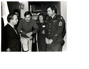 Carl Albert in his office with some disabled veterans., 1950-01-01 - 1976-12-31