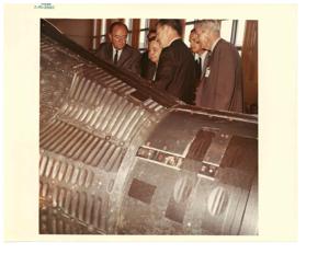 Hubert H. Humphrey listens to a briefing on the Apollo program from Dr. Joseph Shea. Apollo Spacecraft Program Office. Fred Harris and Carl Albert are present. Manned Spacecraft Center, July 13, 1965, 1965-07-13