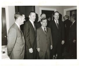 Hubert H. Humphrey listens to a discussion of the Gemini III Spacecraft from Charles W. Matthews manager of the Gemini Program Office, Manned Spacecraft Center, Houston, July 13, 1965 Carl Albert and A. S. Mike Monroney included., 1965-07-13