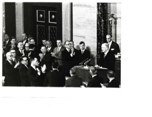 Carl Albert standing at the Speaker&#39;s chair. Gerald R. Ford is also present., 1950-01-01 - 1976-12-31