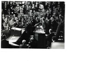 Group of men in the House chamber. Carl Albert and Gerald Ford are pictured., 1950-01-01 - 1976-12-31