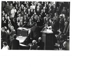 Group of men in the House chamber. Carl Albert and Gerald Ford are pictured., 1950-01-01 - 1976-12-31
