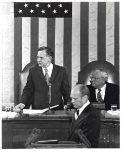 Gerald R. Ford standing at the speaker&#39;s podium. Carl Albert and James O. Eastland sitting behind him. Joint Session of Congress., 1950-01-01 - 1976-12-31