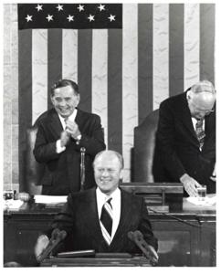 Gerald R. Ford standing at the speaker&#39;s podium. Carl Albert and James O. Eastland sitting behind him. Joint Session of Congress., 1950-01-01 - 1976-12-31