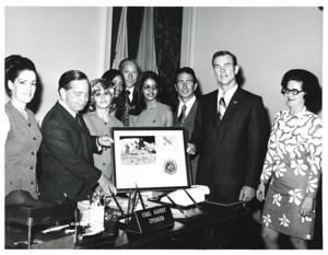 Carl Albert presenting Apollo 15 plaque to astronauts David Scott, Alfred Worden, and James Irwin. Albert&#39;s staff present in speaker&#39;s office. July 26, 1971, 1971-07-26