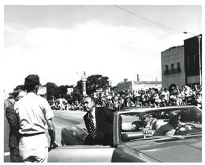 Group of people riding in a parade on Armed Forces Day in McAlester, Oklahoma. 1973, 1973-05-19