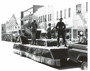 Parade in McAlester, Oklahoma on Armed Forces Day. Carl Albert and Henry Bellmon are pictured in 3845, 1950-01-01 - 1976-12-31