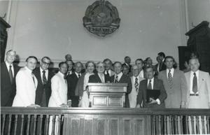 Carl Albert posing with several men in a building in Romania. This is during the House delegation trip to the USSR, Romania, and Yugoslavia. August 1975, 1975-08-04