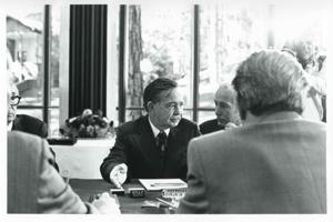 Carl Albert talking with several men., 1975-08-04