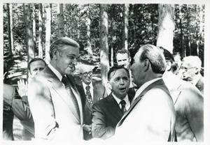 Carl Albert and Leonid Brezhnev standing outside with several others. In Yalta, during the House delegation trip to USSR, Romania, Yugoslavia. August 1975, 1975-08-04