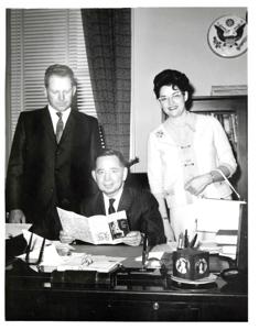 Carl Albert sitting behind a desk with another man., 1950-01-01 - 1976-12-31