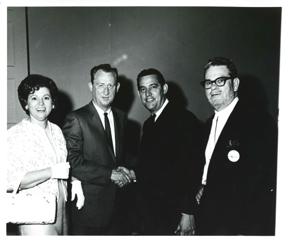 Carl Albert with a group in a hallway., 1950-01-01 - 1976-12-31