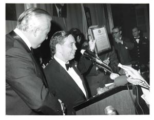 Carl Albert, Mary Albert, and their daughter Mary Frances are shown in crowd. Carl Albert is being hugged by an unidentified woman., 1950-01-01 - 1976-12-31