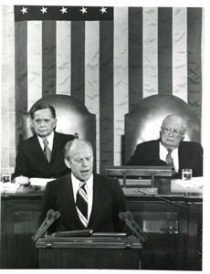Gerald R. Ford speaking at a joint session of Congress. Carl Albert and James O. Eastland also shown. October 8, 1974, 1974-10-08