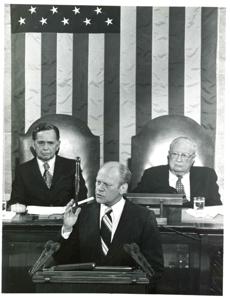 Gerald R. Ford speaking at a joint session of Congress. Carl Albert and James O. Eastland also shown. October 8, 1974, 1974-10-08