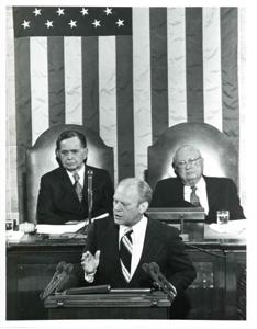 Gerald R. Ford speaking at a joint session of Congress. Carl Albert and James O. Eastland also shown. October 8, 1974, 1974-10-08