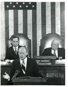 Gerald R. Ford speaking at a joint session of Congress. Carl Albert and James O. Eastland also shown. October 8, 1974, 1974-10-08
