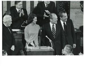 Gerald R. Ford after being sworn into office. From left: Betty Ford, Carl Albert, Gerald R. Ford, James O. Eastland, and Richard M. Nixon. December 6, 1973, 1973-12-06