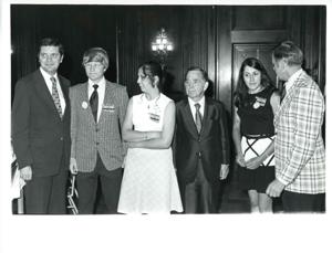 Carl Albert standing behind his desk with an Oklahoma REC group. June 1973, 1973-06-01