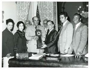 Carl Albert behind his desk with the Oklahoma REC group. June 1973, 1973-06-01