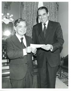 Carl Albert shaking hands with a man., 1970-01-01 - 1976-12-31