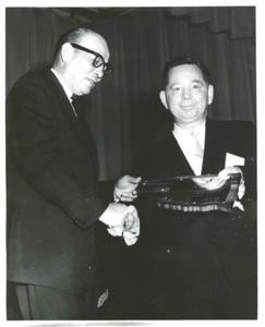 Carl Albert shaking hands with unidentified person., 1970-01-01 - 1976-12-31