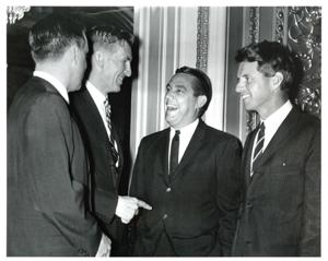 Fred R. Harris and Robert F Kennedy enjoy a laugh with two unidentified men July 1965, 1965-07-01