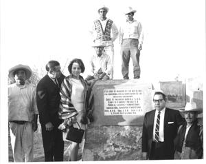 Fred R. Harris reads the inscription on a plaque installed at the site of a well recently completed at San Felipe Teotlalcingo, Puebla, 1963-01-01 - 1976-12-31