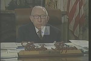 ["In the 1988 presidential campaign ad, Democratic candidate Howard Eliot Wolpe is depicted passionately advocating for senior citizens' rights and benefits. Across various settings, including a podium, a community hall, and a Budget Committee session, Wolpe focuses on protecting Social Security and Medicare, surrounded by supportive seniors and delivering his message with confidence and determination."]
