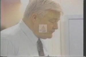 ["In the 1994 political TV ad for Democratic presidential candidate Francis E. Gall, he is portrayed consistently as a trustworthy and confident leader. Throughout various scenes, Gall is shown addressing large, attentive crowds from a podium, with campaign banners in the backdrop. The repetitive nature of these scenes emphasizes his dedication, leadership abilities, and electoral commitment, aligning him strongly with themes of reliability and professionalism in the political arena."]